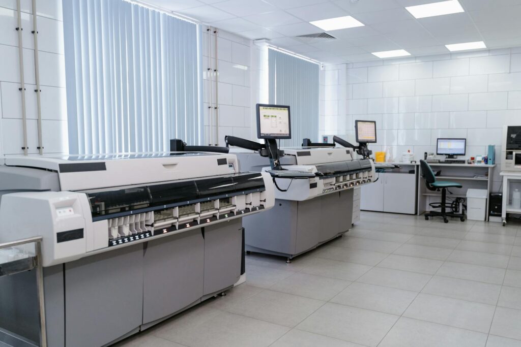 Spacious modern laboratory featuring advanced printing equipment and workstations.