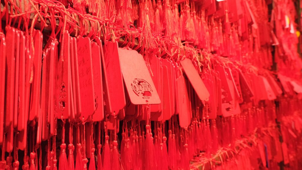 a wall of red plastic forks and spoons