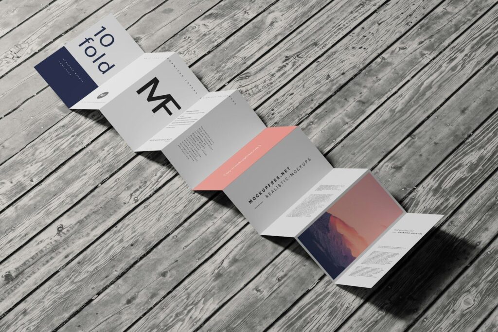 a folded brochure sitting on top of a wooden table