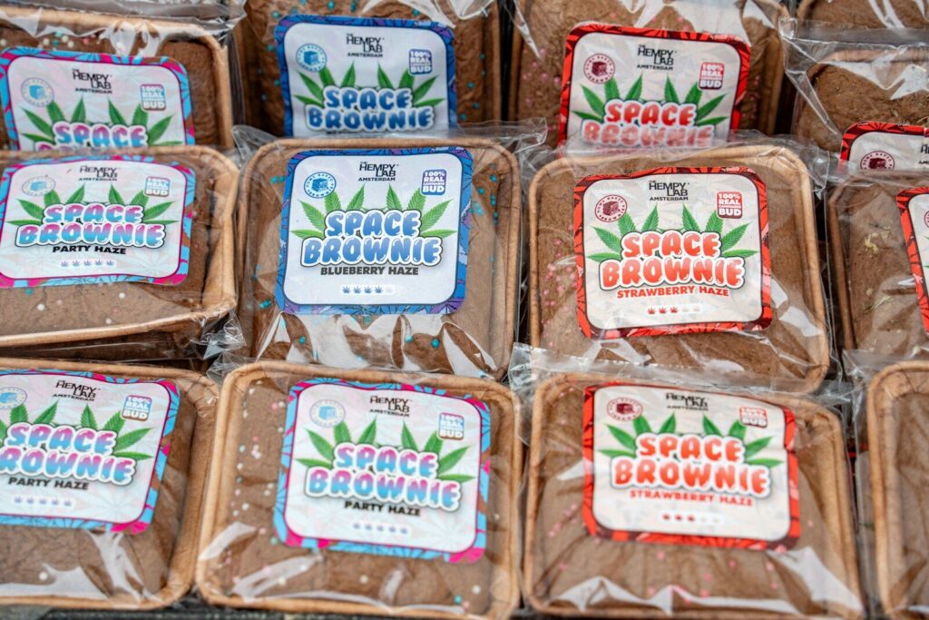 Rows of individually wrapped brownies with colorful labels.