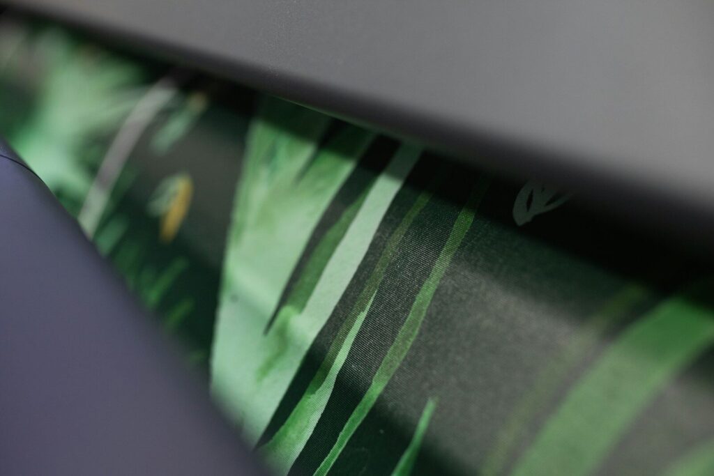 a close up of a green and black wallpaper