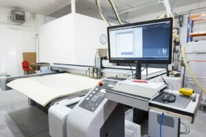 a computer monitor sitting on top of a machine