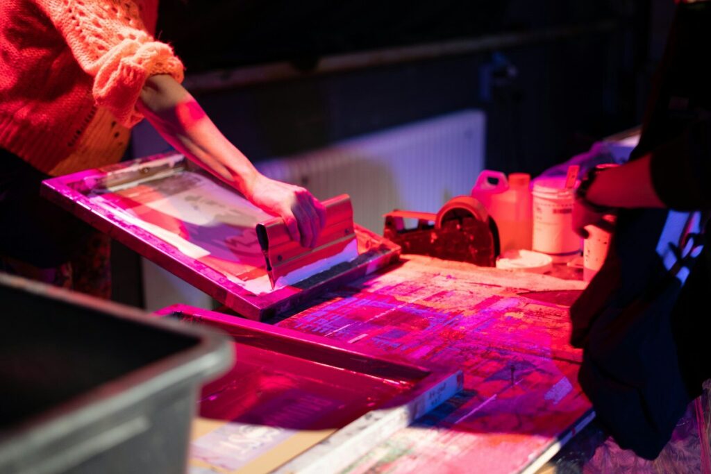 woman in pink dress holding pink textile